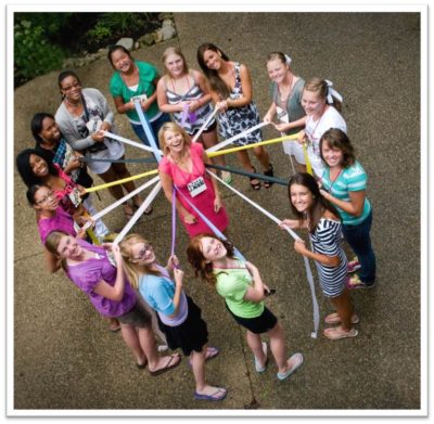 Debbie with girls during a Debbie's Club activity